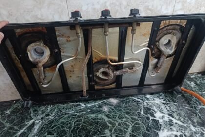 Gas stove opened up — burners, jets and pipes before cleaning